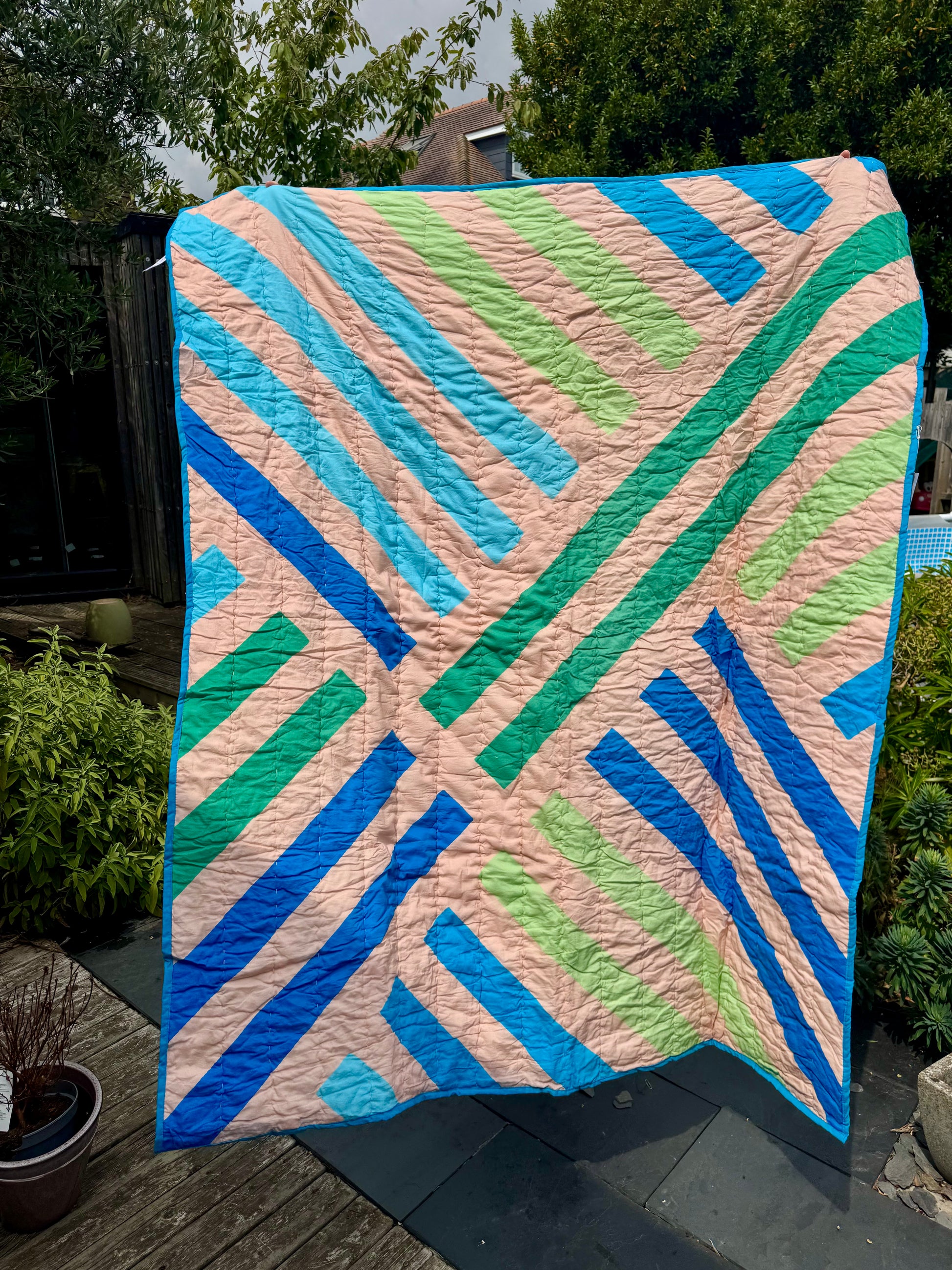 Geometric stripe quilted throw / blanket