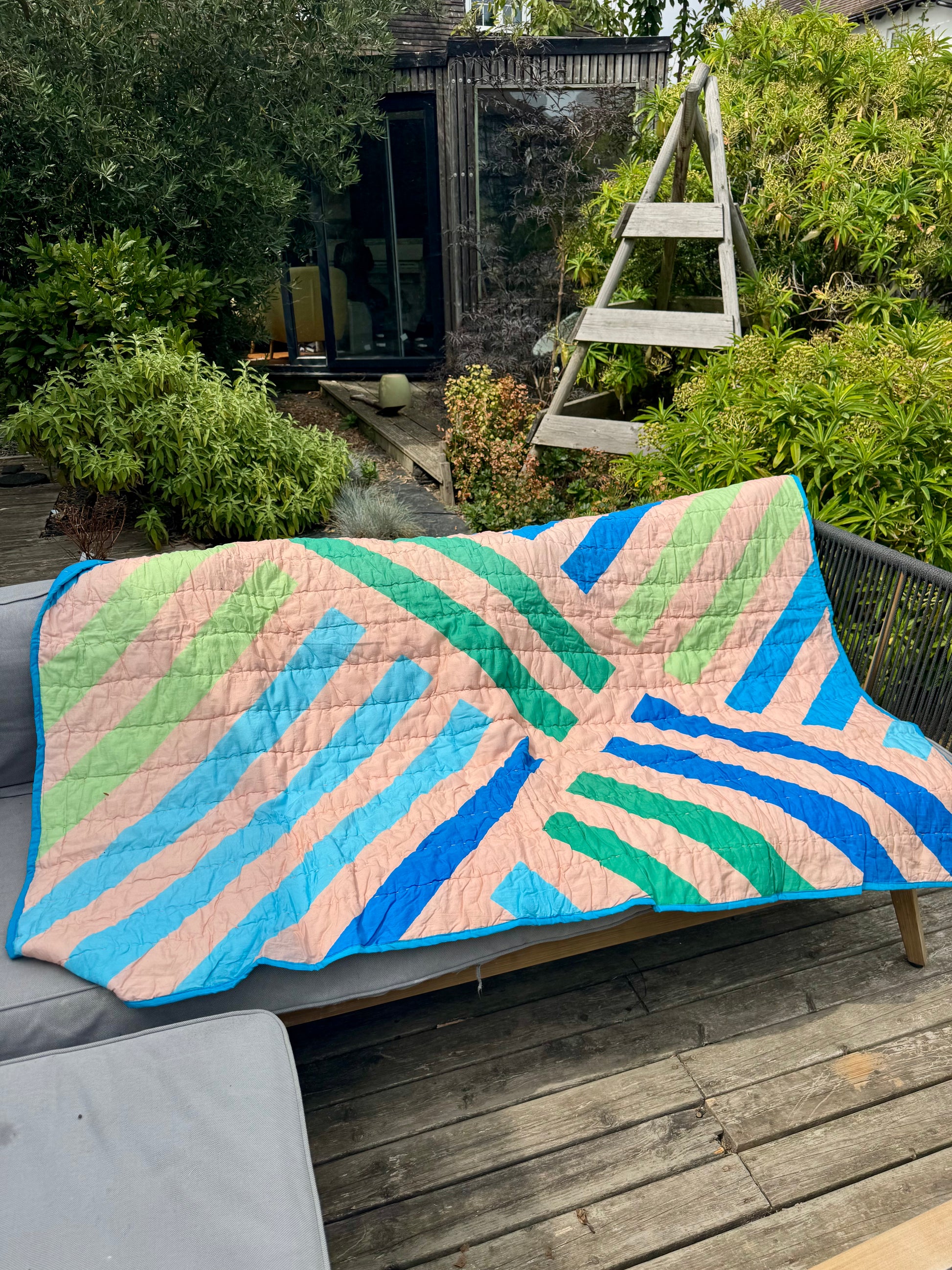 Geometric stripe quilted throw / blanket